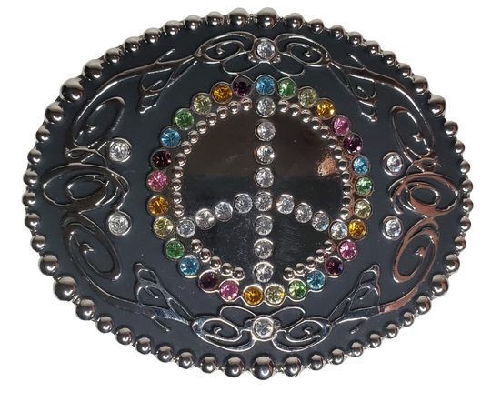 This eye-catching, multifaceted rhinestone peace sign This belt buckle adds a unique flair to any ensemble. Crafted with multicolored rhinestones, this buckle displays a classic peace sign, and is designed to fit a 1 1/2" belt. Measuring 3-1/2" x 2-3/4", this piece is perfect for those looking to add a little pizzazz to an outfit. Located in our Smyrna, TN shop near Nashville, it makes a great addition to any wardrobe.    