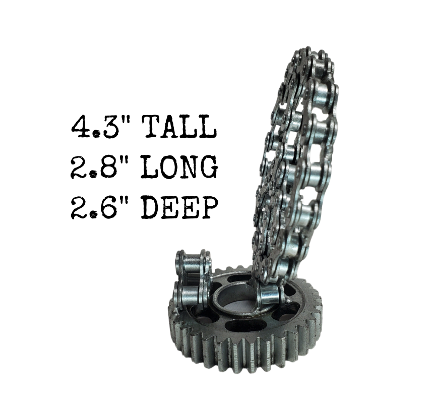 Looking for a unique way to enhance your office? Consider this one-of-a-kind metal art Business Card holder! It's the perfect gift for any Peace Minded Motorhead! Each piece is hand-crafted using sprockets, chains, nuts, bolts, washers, springs, and bearing wheels, making it a truly one-of-a-kind present. For exact measurements, check out the photo. You can find these METAL artwork pieces at our Smyrna store, located just minutes from Nashville, TN.
