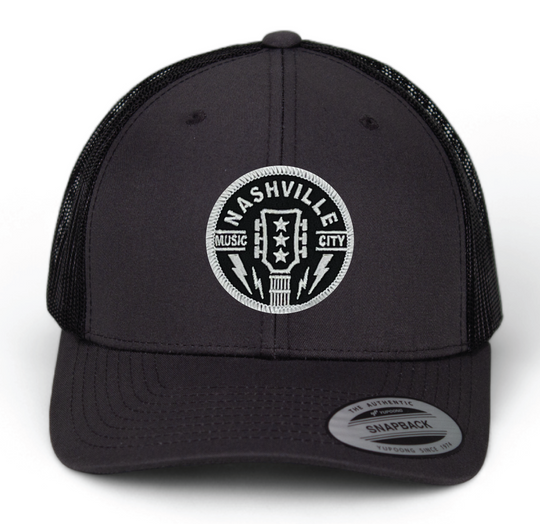 Classic Patched Cap with Music City Nashville and shape of guitar head in the center. Patch is front and center of a snapback cap. This will soon become your favorite cap! Shop now at our Smyrna, TN store or online.

snap back adjustment
Charcoal front with black mesh back