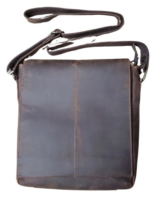 The Administrator Tablet Bag includes an adjustable leather strap strengthened by cotton webbing plus a bonus back zip pocket. Hidden under the flap's magnetic snap closure is a main zippered compartment, small zipper inside pocket, open phone pocket. Durable fabric lines the spacious interior, ensuring safe storage for all your essentials. Discover it at our Smyrna, TN store, conveniently located near Nashville.
