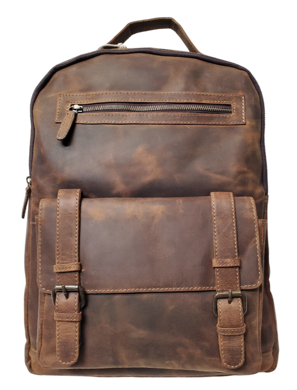 The Governor Leather Backpack is a Classic bag that can carry everything you need for a busy week. Crafted from Distressed leather that will gain a vintage look over time. It features 2 main zippered compartments, a laptop sleeve, space for documents. The magnetic clasp pocket in the front is perfect for power cords. Plus, the adjustable shoulder straps make for a comfortable fit. The back strap easily slides onto your carryon for stress-free travel. Swing by our Smyrna, TN location and snag yours today!
