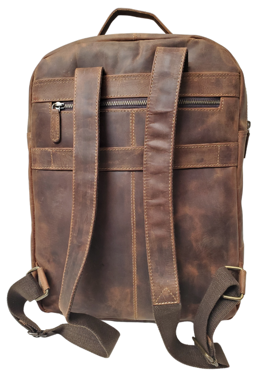 The Governor Leather Backpack is a Classic bag that can carry everything you need for a busy week. Crafted from Distressed leather that will gain a vintage look over time. It features 2 main zippered compartments, a laptop sleeve, space for documents. The magnetic clasp pocket in the front is perfect for power cords. Plus, the adjustable shoulder straps make for a comfortable fit. The back strap easily slides onto your carryon for stress-free travel. Swing by our Smyrna, TN location and snag yours today!