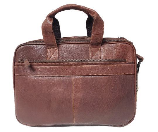 The Colonel Leather Laptop Bag is a no-frills bag that's perfect for the daily hustle. Crafted from buttery soft pebble grain leather, it only gets better with age. With a spacious main pocket, computer sleeve, and room for paperwork and snacks, it's got your weekday needs covered. Power cords? No problem! Just stash them in one of the two outside zippered pockets. And for ultimate convenience, it comes with an adjustable shoulder strap. Swing by our Smyrna, TN shop and snag one today!