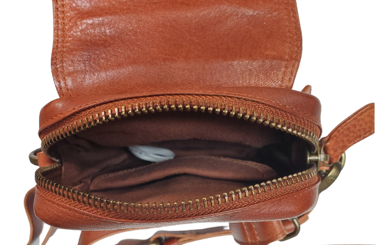 The Jackie Crossbody Purse is the perfect companion for carrying just the essentials - phone, driver's license, and debit card. With an adjustable strap, 2 external zippered pockets, and inner card slots, this bag is both functional and convenient. Available now at our store in Smyrna, TN! Choose from 3 colors.