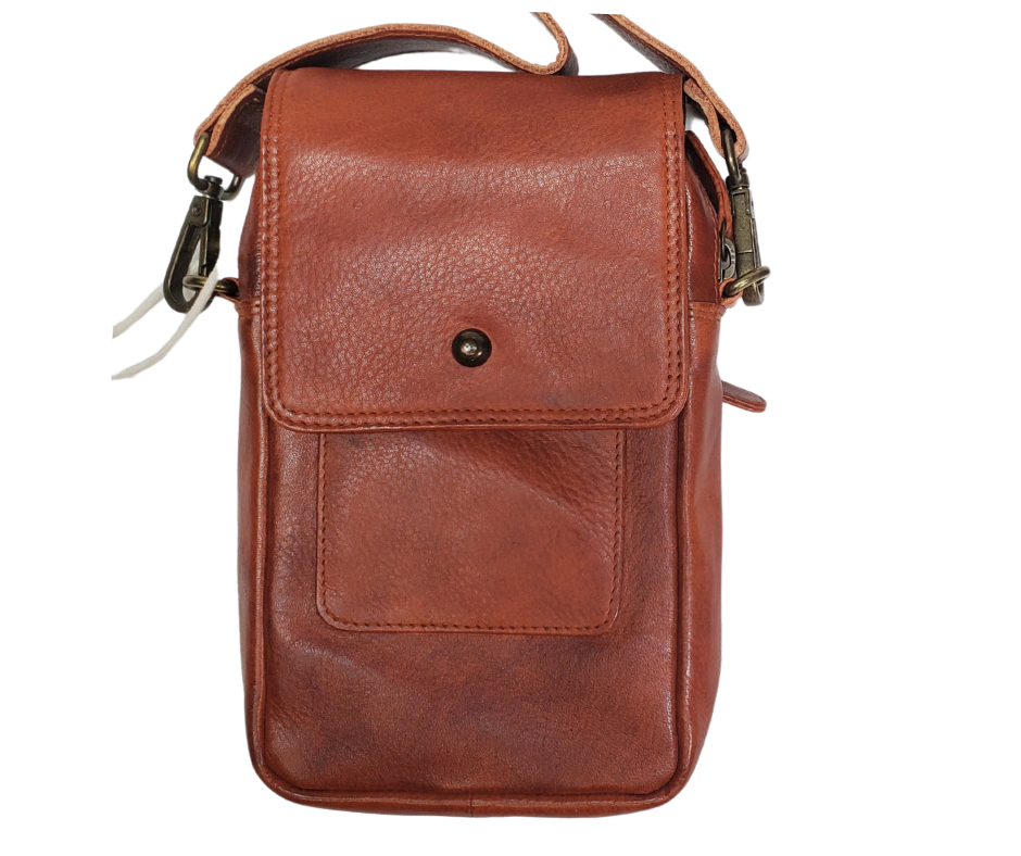 The Jackie Crossbody Purse is the perfect companion for carrying just the essentials - phone, driver's license, and debit card. With an adjustable strap, 2 external zippered pockets, and inner card slots, this bag is both functional and convenient. Available now at our store in Smyrna, TN! Choose from 3 colors.