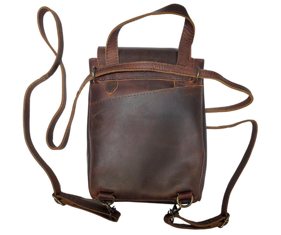 Looking for a trusty companion for your hectic weeks? Look no further than The Jade Backpack Purse! Perfectly sized for all your must-haves, this versatile bag can be worn on your belt, slung over your shoulder, or used as a Crossbody. With convenient card slots, a main center pocket, and a handy back slip pocket, you'll be ready to conquer anything. Now in our Smyrna, TN shop 5 days a week.