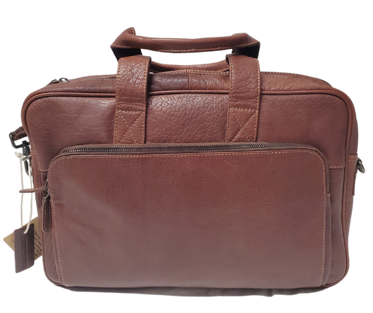 The Colonel Leather Laptop Bag is a no-frills bag that's perfect for the daily hustle. Crafted from buttery soft pebble grain leather, it only gets better with age. With a spacious main pocket, computer sleeve, and room for paperwork and snacks, it's got your weekday needs covered. Power cords? No problem! Just stash them in one of the two outside zippered pockets. And for ultimate convenience, it comes with an adjustable shoulder strap. Swing by our Smyrna, TN shop and snag one today!