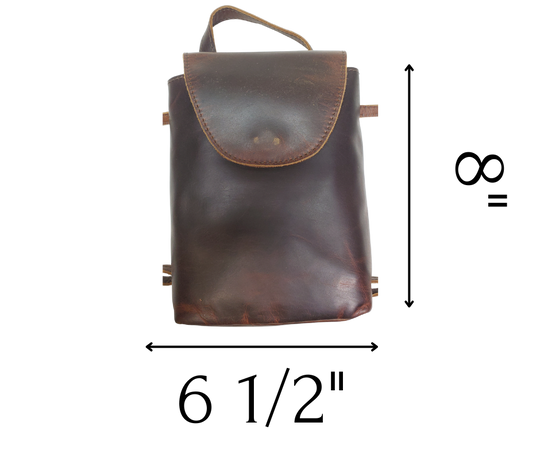 Looking for a trusty companion for your hectic weeks? Look no further than The Jade Backpack Purse! Perfectly sized for all your must-haves, this versatile bag can be worn on your belt, slung over your shoulder, or used as a Crossbody. With convenient card slots, a main center pocket, and a handy back slip pocket, you'll be ready to conquer anything. Now in our Smyrna, TN shop 5 days a week.