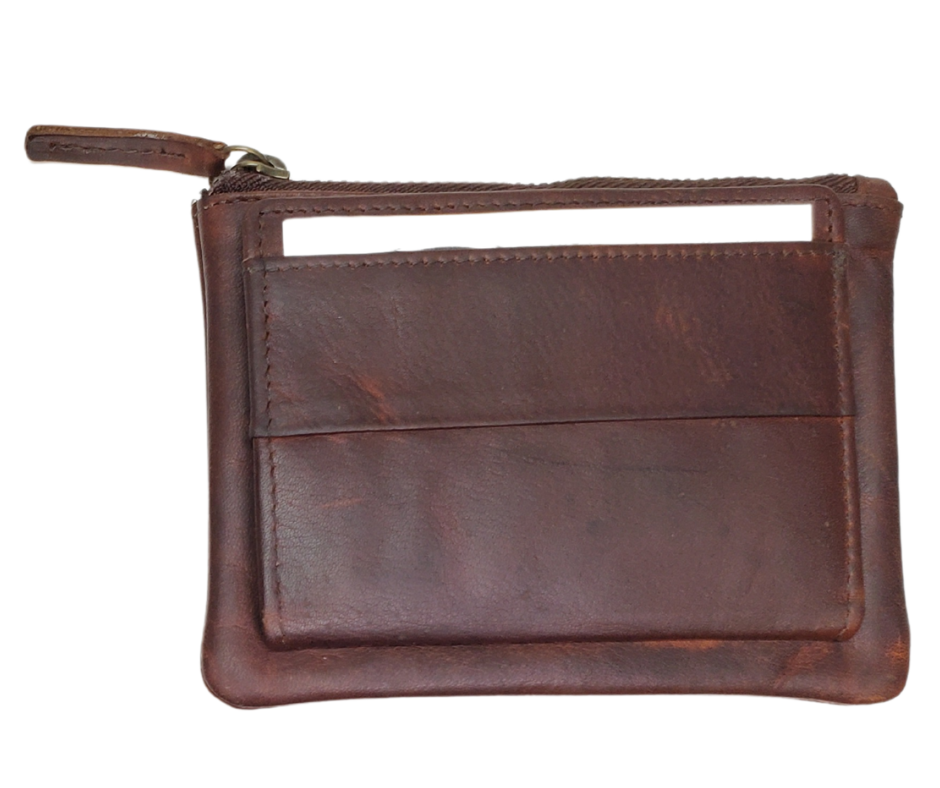 Looking to simplify your life? The "Carter" Coin Pouch Wallet might be just the ticket. It has just the right number of card slots, an ID slot, and a zippered pouch for your little extras and coins. The size is perfect for front pockets, and it even has RFID security. Come visit our shop in Smyrna, TN and put your minimalist skills to the test!
