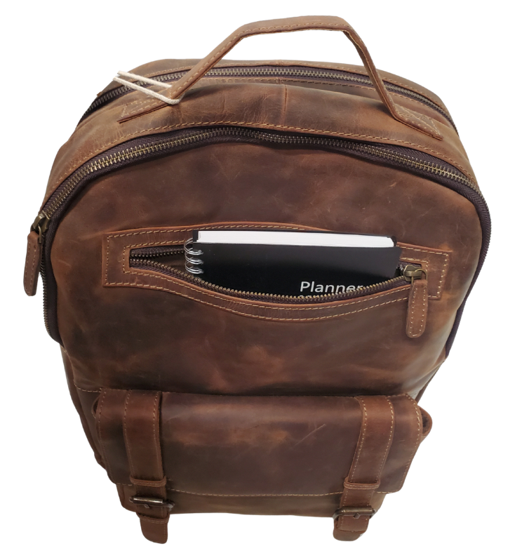 The Governor Leather Backpack is a Classic bag that can carry everything you need for a busy week. Crafted from Distressed leather that will gain a vintage look over time. It features 2 main zippered compartments, a laptop sleeve, space for documents. The magnetic clasp pocket in the front is perfect for power cords. Plus, the adjustable shoulder straps make for a comfortable fit. The back strap easily slides onto your carryon for stress-free travel. Swing by our Smyrna, TN location and snag yours today!