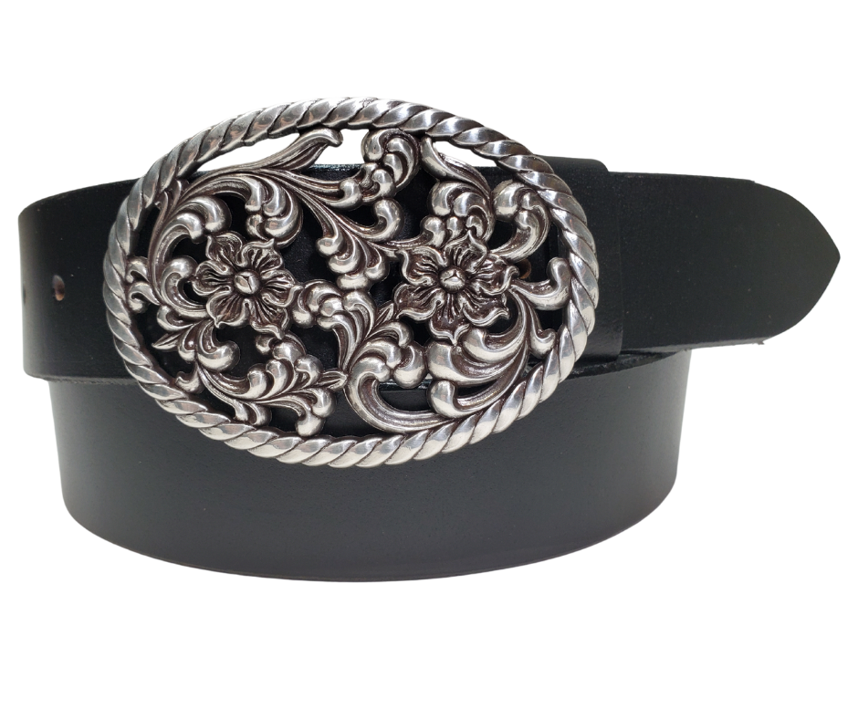 Our Prairie Nights shaped oval buckle has a rope edge, a Filigreed Floral center. It is Antiqued Silver or Brass colored, measures 2 3/4" tall by 3 3/4" wide and fits belts up to 1 1/2" wide. Buckle is made in Taiwan. Belt is a single strip of leather that is 1 1/2" wide and available in sizes 34" to 44". Colors are distressed brown or black. CHOOSE ONE BELT STRIP COLOR! It is available for purchase in our retail shop in Smyrna, TN, just outside Nashville and also in our online store.
