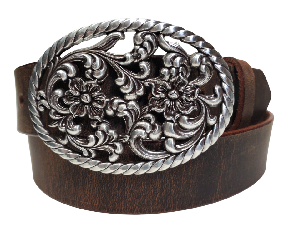 Our Prairie Nights shaped oval buckle has a rope edge, a Filigreed Floral center. It is Antiqued Silver or Brass colored, measures 2 3/4" tall by 3 3/4" wide and fits belts up to 1 1/2" wide. Buckle is made in Taiwan. Belt is a single strip of leather that is 1 1/2" wide and available in sizes 34" to 44". Colors are distressed brown or black. CHOOSE ONE BELT STRIP COLOR! It is available for purchase in our retail shop in Smyrna, TN, just outside Nashville and also in our online store.