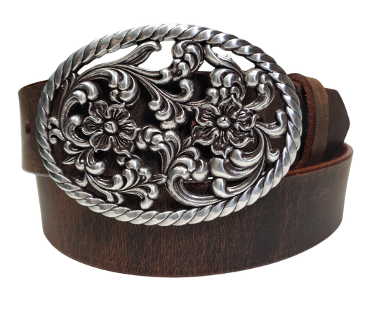 Our Prairie Nights shaped oval buckle has a rope edge, a Filigreed Floral center. It is Antiqued Silver or Brass colored, measures 2 3/4" tall by 3 3/4" wide and fits belts up to 1 1/2" wide. Buckle is made in Taiwan. Belt is a single strip of leather that is 1 1/2" wide and available in sizes 34" to 44". Colors are distressed brown or black. CHOOSE ONE BELT STRIP COLOR! It is available for purchase in our retail shop in Smyrna, TN, just outside Nashville and also in our online store.