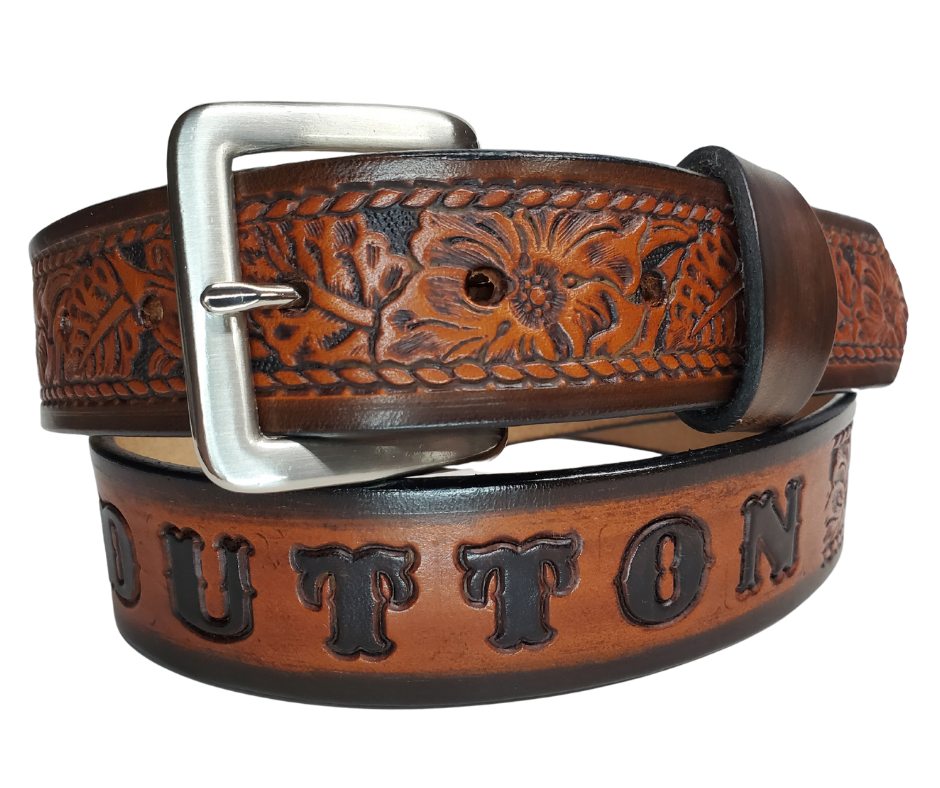 Our "The Ranch" Name Leather Belt can be personalized! It is Veg-tan leather belt, aptly named "The Ranch," with it's Western scroll pattern framed in a Rope edge border. Made in Smyrna, TN, close to Nashville. It's interchangeable solid brass buckle ensures convenience while maintaining high quality. Elevate any outfit with this stylish and versatile accessory.