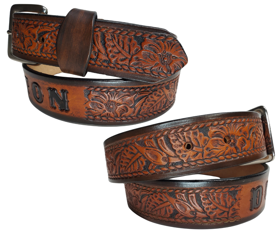 Our "The Ranch" Name Leather Belt can be personalized! It is Veg-tan leather belt, aptly named "The Ranch," with it's Western scroll pattern framed in a Rope edge border. Made in Smyrna, TN, close to Nashville. It's interchangeable solid brass buckle ensures convenience while maintaining high quality. Elevate any outfit with this stylish and versatile accessory.