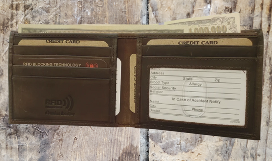 RFID protected Bi-fold in Distressed Brown. Card slots, underside pockets and I.D. flap PLUS divided cash pockets. Imported, Great Value, and Buckle and Hide approved! Stocked at our Smyrna, TN shop.&amp;nbsp;  Bi-Fold specs - 4 1/2"x 3 1/2"x 5/8" folded, 2 cash slots, 5 CC slots, 1 I.D. slot, 2 underside pockets.