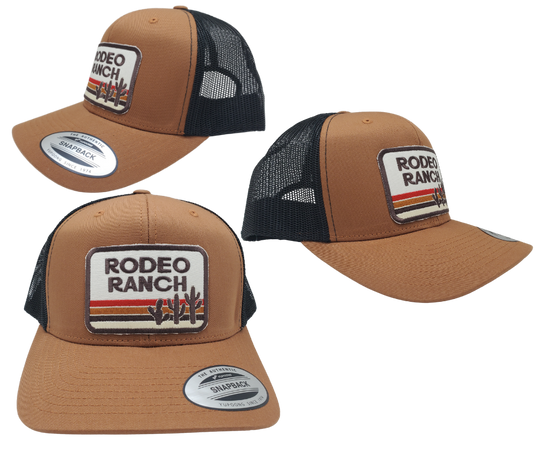 Get ready for your night out with our Rodeo Ranch Retro Cap! This trendy Embroidered Trucker Cap boasts a bold sandy color, hot desert vibes, and an iconic cactus design. Featuring a cool black mesh back, a stylish tan front, and a convenient snapped adjustable strap. Grab yours today at our shop in Smyrna, TN, right outside Nashville