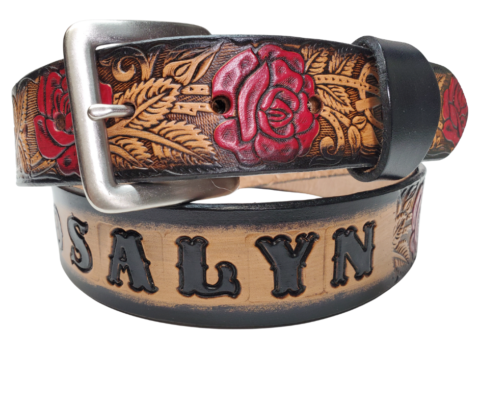 The Rose Bud Leather Name belt with a detailed Timeless Rose Vine pattern. This is the Deluxe version which means it has extra color added to enhance the pattern. Like our other belts it has snaps for easy change of buckles. It's our 9-10 oz veg-tan cowhide that's approx. 1/8" thick. It's embossed and hand stained and fitted with our standard Antique Silver over Solid brass buckle. These are made and shipped weekly only in our Smyrna, TN shop not far from Opry Mills Mall.