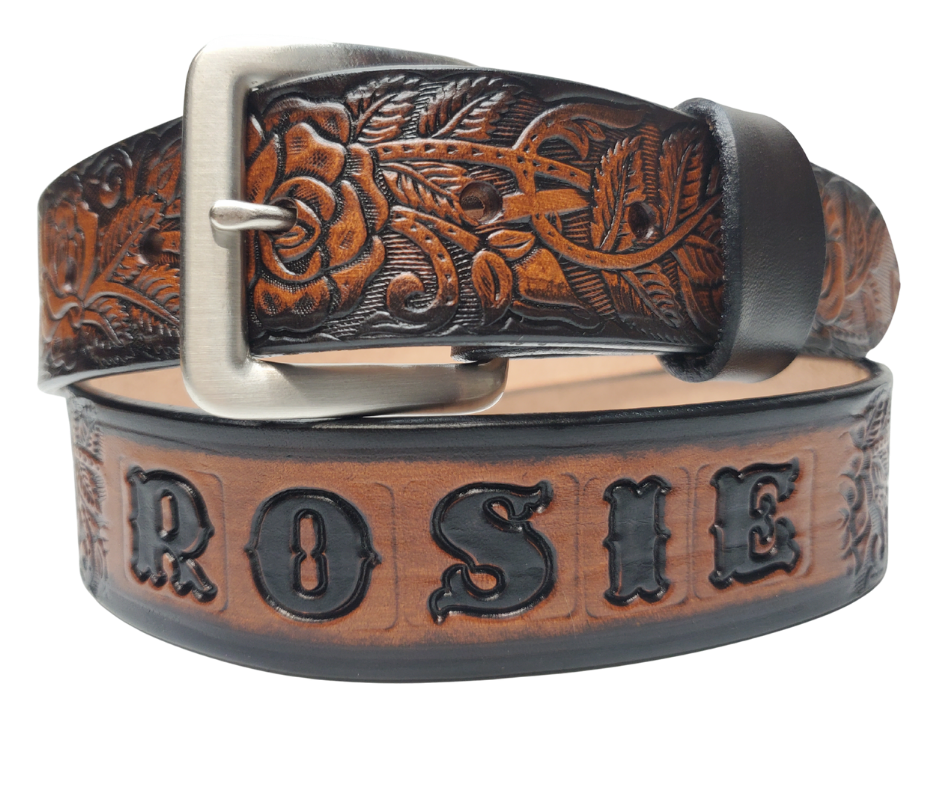The Rose Bud Leather Name belt with a detailed Timeless Rose Vine pattern. Like our other belts it has snaps for easy change of buckles. It's our 9-10 oz veg-tan cowhide that's approx. 1/8" thick. It's embossed and hand stained and fitted with our standard Antique Silver over Solid brass buckle. These are made and shipped weekly only in our Smyrna, TN shop not far from Opry Mills Mall.&nbsp;

1 1/2" WIDTH