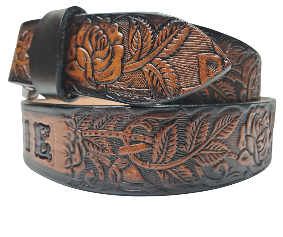 The Rose Bud Leather Name belt with a detailed Timeless Rose Vine pattern. Like our other belts it has snaps for easy change of buckles. It's our 9-10 oz veg-tan cowhide that's approx. 1/8" thick. It's embossed and hand stained and fitted with our standard Antique Silver over Solid brass buckle. These are made and shipped weekly only in our Smyrna, TN shop not far from Opry Mills Mall.&nbsp;

1 1/2" WIDTH