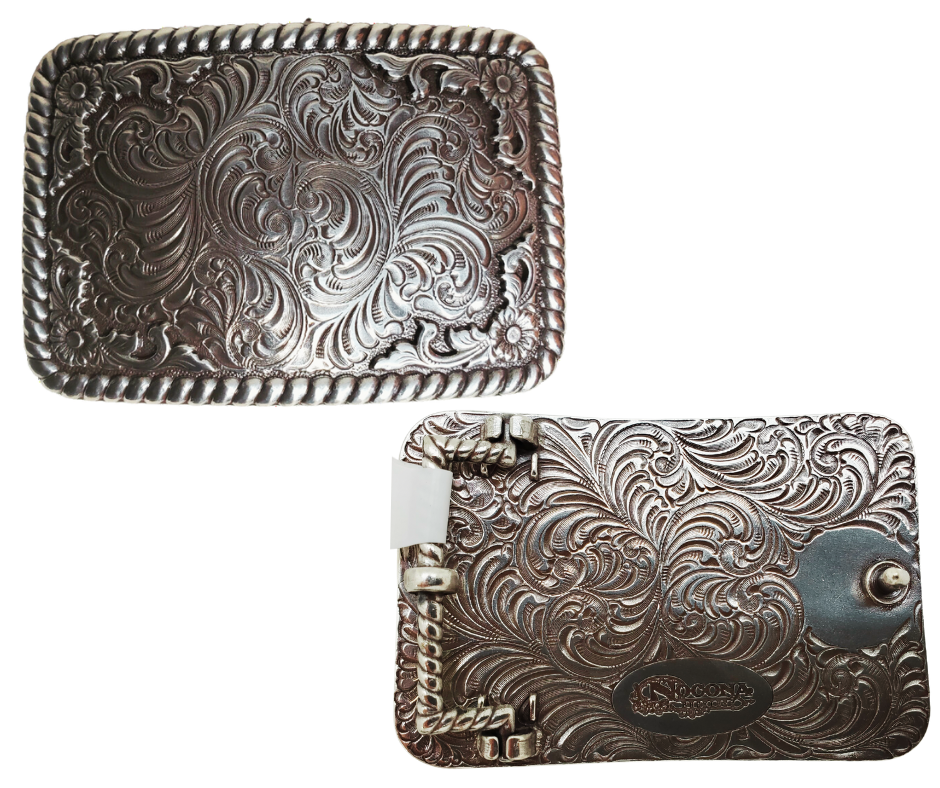 This rectangular shaped buckle by Nocona has rounded edges with rope design around the border. It is chrome colored with scroll design etched appearance on surface.&nbsp; Measures 2 3/4" tall by 3 3/4" wide and fits belts up to 1 1/2" wide.&nbsp; It is available for purchase in our retail shop in Smyrna, TN, just outside Nashville and also on the online store. 