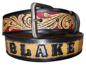 This DELUXE Rustler Name Leather Belt features a classic western Scroll pattern embossed on a 9-10 oz vegetable-tanned cowhide. You may customize the buckle with the added snaps. It is named Deluxe because of the additional color added to the background of the pattern. This product is crafted with care in our Smyrna, TN shop, just outside Nashville, TN.      