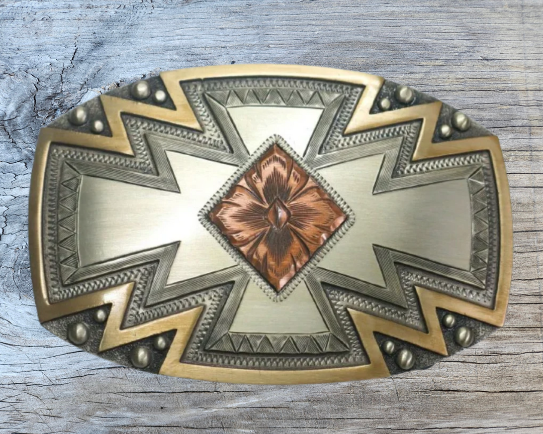 The Radiance Belt Buckle impresses an design idea that results from a bright fire with a Southwestern overtones. Made from German Silver and engraved and layered metals in a tri-color Southwestern design. Available in our Smyrna, TN shop, a short distance from Nashville.

Dimensions: Width 4”, Height 2.7”
Standard 1.5” Swivel