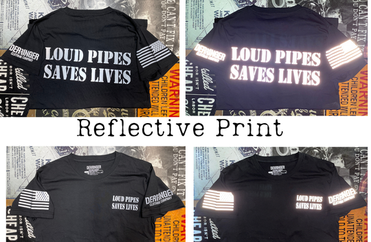 Make a statement with the REFLECTIVE design on our Loud Pipes Saves Lives short sleeve tee. Crafted from soft, lightweight cotton, it features bold "Loud Pipes Save Lives" graphics on the back, a smaller version on the chest, a USA flag on the right sleeve, and the Derringer logo on the left. Now stocked in our Smyrna, TN shop, just a short ride from Bumpus HD in Murfreesboro. Sizes M-3X.