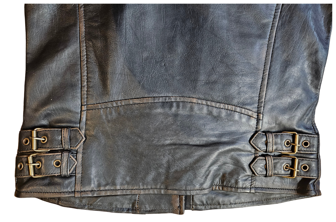The Timeless MC style Rhiannon Jacket in Soft and supple Distressed Brown leather. Black lining. Antique brass hardware. 4 outside pockets, 2 inside conceal carry pockets, 4 waist straps for adjustments. Ride to Smyrna, TN outside of Nashville and gets yours. Sizes XS-5XL.