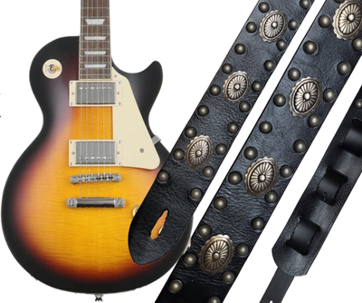 Les Paul's and Billy Gibbon's have been staple for years in Rock music!  "This 2" wide Guitar Strap is a nod to that classic influence. It's made from Pebbled Veg-Tan Cowhide and after some gig's it'll look like you bought in a Vintage shop. The classic adjustment style goes from approx. 42" to 56" at it's longest . Made just outside Nashville in our Smyrna, TN. shop. It will need a bit of time to "break in" but will get a great patina over time.  