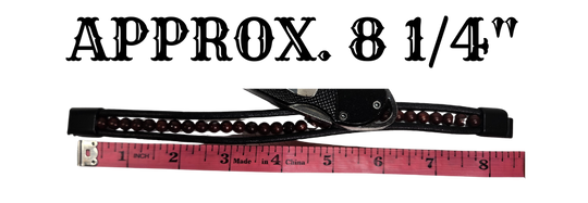 Measurement of bracelet with a ruler showing &
