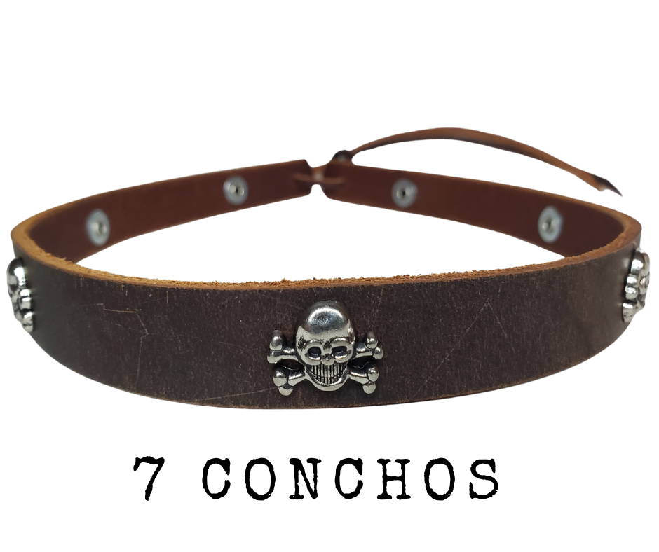 Get a little Edgy with our Skull and Cross bone hatband! Our 7 Skull concho leather hatband is 3/4" wide by 23" (without tie string). Available in black or brown, pick one or a few. Fit's most any hat with adjustable bead and leather 1/8" string. Will fit most TOP HAT style and WESTERN crowned hats. Made in our Smyrna, TN shop.
