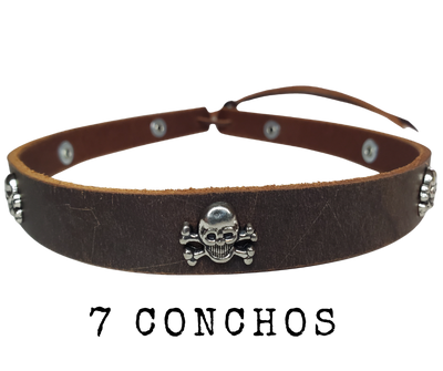 Get a little Edgy with our Skull and Cross bone hatband! Our 7 Skull concho leather hatband is 3/4" wide by 23" (without tie string). Available in black or brown, pick one or a few. Fit's most any hat with adjustable bead and leather 1/8" string. Will fit most TOP HAT style and WESTERN crowned hats. Made in our Smyrna, TN shop.