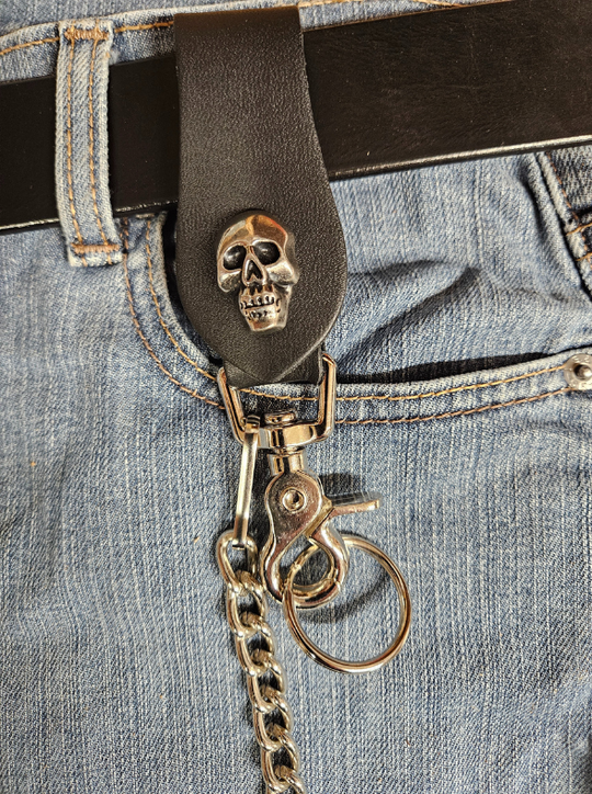 This Vintage style Steel Chain with a Skull Head Concho. Simple but Sturdy and will keep your wallet where it needs to be. The Leather loop, decorated with a Skull concho, attaches to your jeans and the split ring attaches to your wallet. Chrome plated. Ride down and get yours in our shop just outside Nashville in Smyrna, TN.

18" Chain Length
Leather belt tab