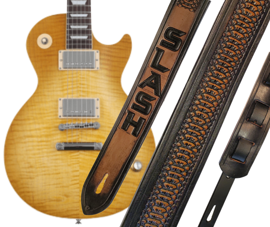 Les Paul's and Slash have been staple for years in Rock music!  "This 2" wide Guitar Strap is a nod to that classic influence. It's made from 1/8" thick Veg-Tan Cowhide and after some gig's it'll look like you bought in a Vintage shop. The classic adjustment style goes from approx. 42" to 56" at it's longest . Made just outside Nashville in our Smyrna, TN. shop. It will need a bit of time to "break in" but will get a great patina over time. 