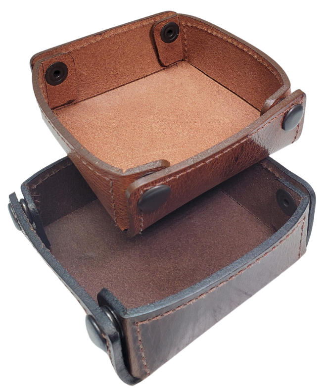 The Capitol Valet Travel Tray is our handmade valet tray is 1 layer of Water Buffalo leather. It's a little different than our other tray because it's more of a Rectangle/Square shape. The corners are held together with heavy line 24 Antique Brass colored snaps, for laying flat for travel, a place for placing keys, wallet, coins, etc. Made in our shop just outside Nashville in Smyrna, TN.

Small is Approx. 4"x 4"
Medium is approx. 4"x6"
Large is approx. 8"x 6"