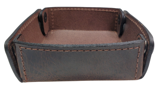 The Capitol Valet Travel Tray is our handmade valet tray is 1 layer of Water Buffalo leather. It's a little different than our other tray because it's more of a Rectangle/Square shape. The corners are held together with heavy line 24 Antique Brass colored snaps, for laying flat for travel, a place for placing keys, wallet, coins, etc. Made in our shop just outside Nashville in Smyrna, TN.

Small is Approx. 4"x 4"
Medium is approx. 4"x6"
Large is approx. 8"x 6"