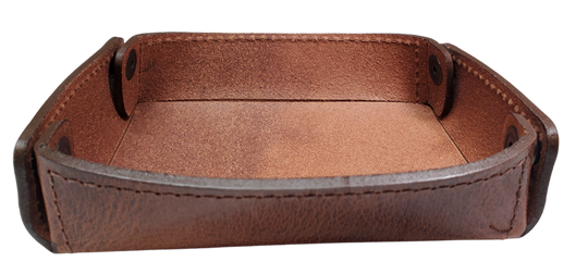 The Capitol Valet Travel Tray is our handmade valet tray is 1 layer of Water Buffalo leather. It's a little different than our other tray because it's more of a Rectangle/Square shape. The corners are held together with heavy line 24 Antique Brass colored snaps, for laying flat for travel, a place for placing keys, wallet, coins, etc. Made in our shop just outside Nashville in Smyrna, TN.

Small is Approx. 4"x 4"
Medium is approx. 4"x6"
Large is approx. 8"x 6"