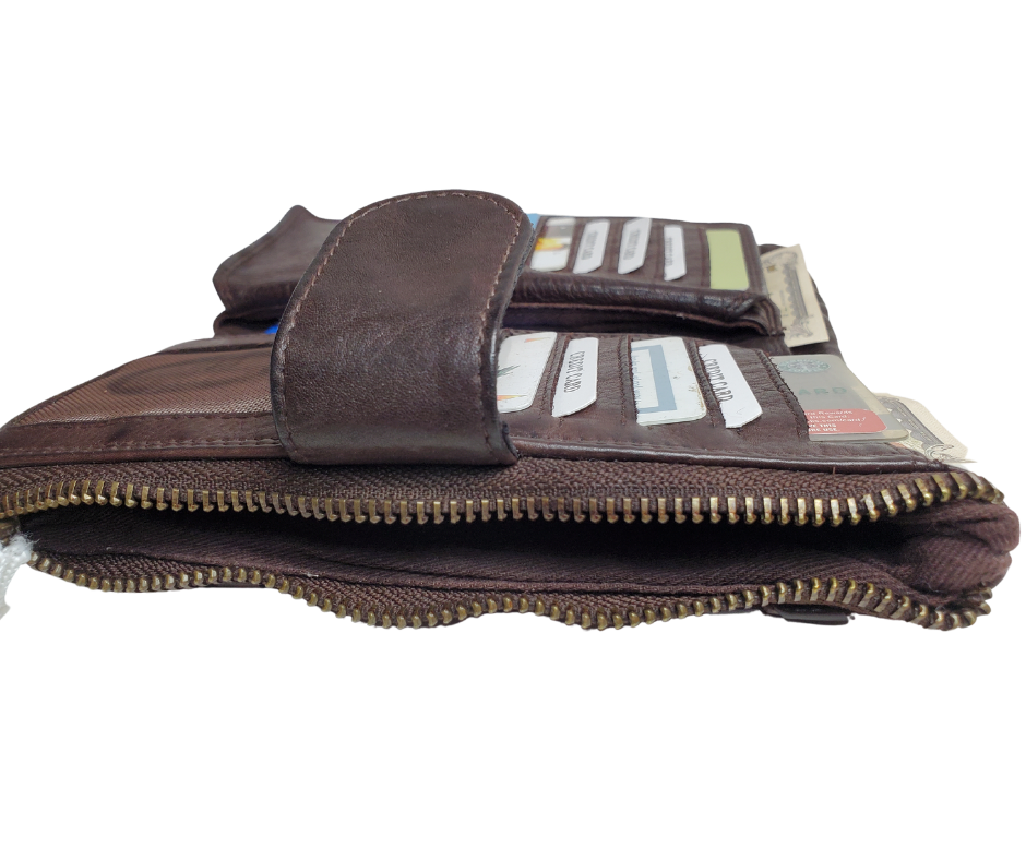 Our Katelyn Leather Long Clutch Wallet is a stylish way to tote your necessities. Soft to touch with plenty of space. Unsnap it and see 11 card slots, an I.D. slot, 2 underside cash pockets, also room for a checkbook, zippered pocket and a larger open pocket for important notes or receipts to keep everything secure. Stocked in Smyrna, TN and it's only 20 minutes from Nashville!