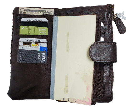 Our Katelyn Leather Long Clutch Wallet is a stylish way to tote your necessities. Soft to touch with plenty of space. Unsnap it and see 11 card slots, an I.D. slot, 2 underside cash pockets, also room for a checkbook, zippered pocket and a larger open pocket for important notes or receipts to keep everything secure. Stocked in Smyrna, TN and it's only 20 minutes from Nashville!