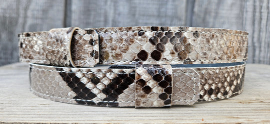 The Headliner Python Snake Skin Hatband is cut to show the back pattern. This band is 1" in width and adjust with a Velcro loop that you can tighten or loose to fit your favorite hats. You can bring your hat and try them out if you come to our Smyrna, TN shop not far from Nashville.

Please keep in mind the patterns will ALWAYS vary since this is a natural skin, these are NOT manufactured skins.
Center Cut is a more defined scale pattern&amp;nbsp;
Side cut has more a mix of colors