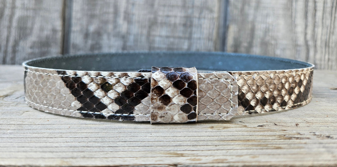 The Headliner Python Snake Skin Hatband is cut to show the back pattern. This band is 1" in width and adjust with a Velcro loop that you can tighten or loose to fit your favorite hats. You can bring your hat and try them out if you come to our Smyrna, TN shop not far from Nashville.

Please keep in mind the patterns will ALWAYS vary since this is a natural skin, these are NOT manufactured skins.
Center Cut is a more defined scale pattern&amp;nbsp;
Side cut has more a mix of colors