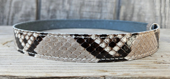The Headliner Python Snake Skin Hatband is cut to show the back pattern. This band is 1" in width and adjust with a Velcro loop that you can tighten or loose to fit your favorite hats. You can bring your hat and try them out if you come to our Smyrna, TN shop not far from Nashville.

Please keep in mind the patterns will ALWAYS vary since this is a natural skin, these are NOT manufactured skins.
Center Cut is a more defined scale pattern&amp;nbsp;
Side cut has more a mix of colors