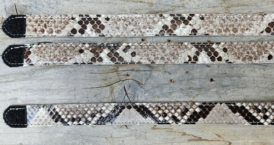 The Headliner Python Snake Skin Hatband is cut to show the back pattern. This band is 1" in width and adjust with a Velcro loop that you can tighten or loose to fit your favorite hats. You can bring your hat and try them out if you come to our Smyrna, TN shop not far from Nashville.

Please keep in mind the patterns will ALWAYS vary since this is a natural skin, these are NOT manufactured skins.
Center Cut is a more defined scale pattern&amp;nbsp;
Side cut has more a mix of colors