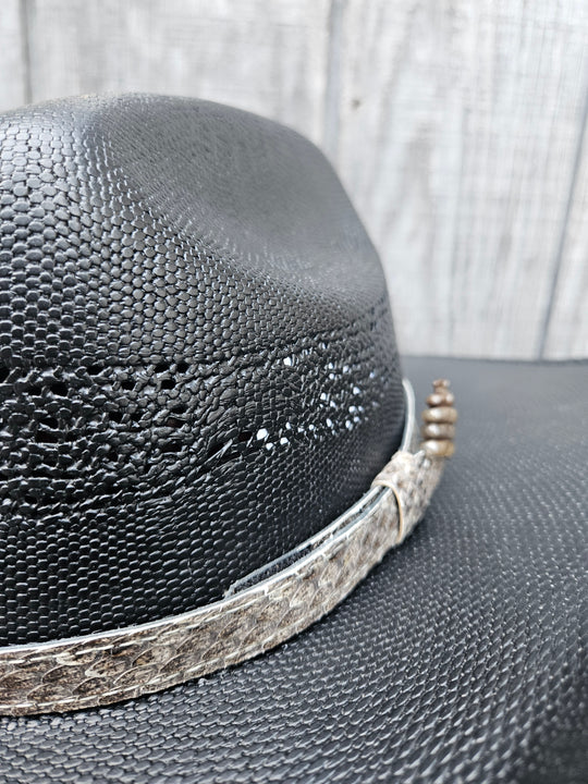 This is a Western Diamondback Snake Skin Hatband. The Western pattern is a little less defined than the Eastern or a Canebrake. The have a Rattler at the of the band that points up slightly and will connect together with a velcro adjustmentand a sliding keeper. Authentic Rattlesnake skin with a pigskin back. Of course you can pick them out if you come to our Smyrna, TN shop not far from Nashville.