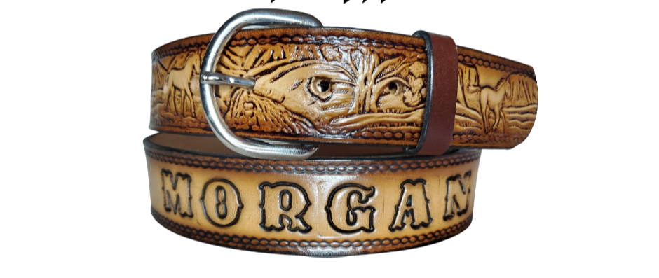 The Stallion leather belt has Horses running in the wild Brown Antiqued finish. Available in a 1 1/2" width. Full grain vegetable tanned cowhide, Width 1 1/2" and includes Nickle plated  buckle Smooth burnished painted edges. Made in USA! For name Type name OR No Name  in "Type Name Here" section.  Buckle snaps in place for easy changing if desired. In stock at our Smyrna, TN shop.