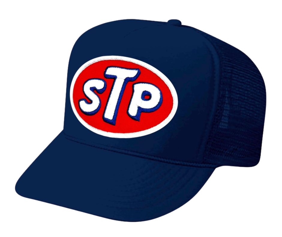 This STP hat is part of our new Navy Blue Foam Front Classic Trucker Hat Collection. This Curved Bill mesh back trucker hat features a big Vintage STP Embroidered Patch sewn on the front panel making this is as old school cool as it gets! Snapback one size fits most y’all.&nbsp;Get yours now at our Smyrna, TN store or online!