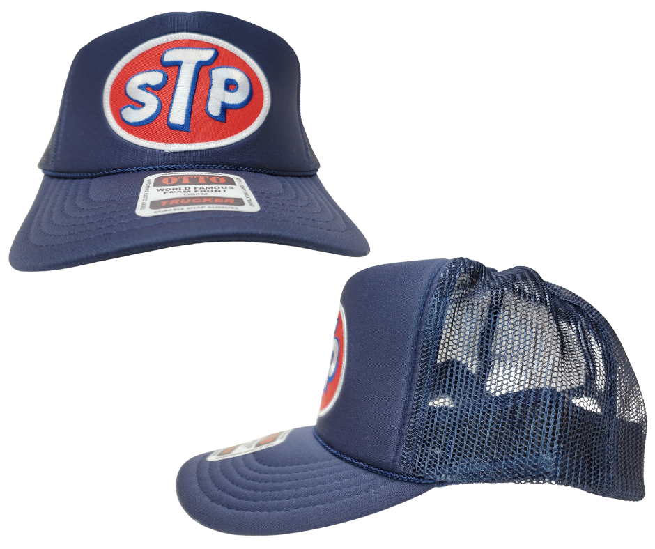 This STP hat is part of our new Navy Blue Foam Front Classic Trucker Hat Collection. This Curved Bill mesh back trucker hat features a big Vintage STP Embroidered Patch sewn on the front panel making this is as old school cool as it gets! Snapback one size fits most y’all.&nbsp;Get yours now at our Smyrna, TN store or online!