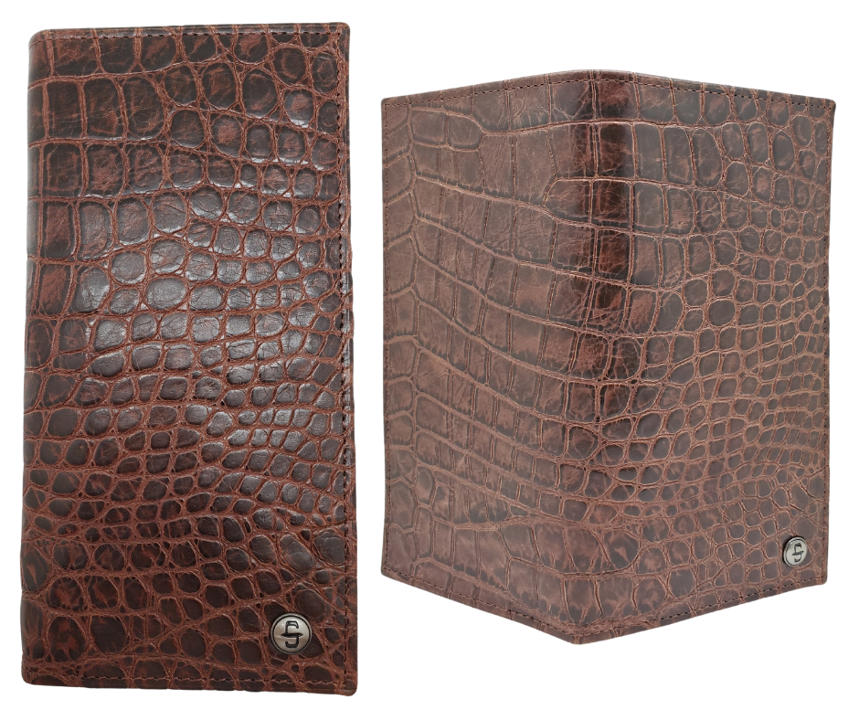 Fully Licensed Stetson Logo Roper/Checkbook style Wallet. Made from Cognac Brown Croc or Black print cowhide leather so good it's really hard to tell the difference from the real thing! Classic Roper design on the inside made from soft durable cowhide leather. Featuring on the left inside 6 card slots and I.D. pocket along 2 underside pockets. On the right inside 1 under pocket with a additional slot on top. In stock at our Smyrna, TN retail store 30 min. from downtown Nashville. Imported.