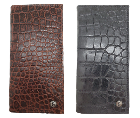 Fully Licensed Stetson Logo Roper/Checkbook style Wallet. Made from Cognac Brown Croc or Black print cowhide leather so good it's really hard to tell the difference from the real thing! Classic Roper design on the inside made from soft durable cowhide leather. Featuring on the left inside 6 card slots and I.D. pocket along 2 underside pockets. On the right inside 1 under pocket with a additional slot on top. In stock at our Smyrna, TN retail store 30 min. from downtown Nashville. Imported.